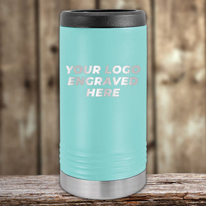 A turquoise Kodiak Coolers insulated tumbler with a black lid and silver base sits on wood, showing "YOUR LOGO ENGRAVED HERE." Perfect for custom logo branding. 4th of July SALE: $200 minimum order, front engraving included.