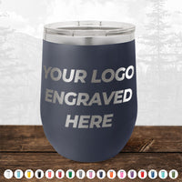 A black Kodiak Coolers insulated tumbler with "YOUR LOGO ENGRAVED HERE" on the front. This promotional gift, known as Custom Drinkware Engraved with your Logo or Design, comes with various color options and is currently part of a HUGE LABOR DAY SALE that ends today!