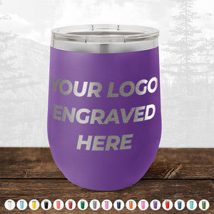 Description: A Kodiak Coolers insulated tumbler in purple, featuring the text "YOUR LOGO ENGRAVED HERE" against an outdoor backdrop with trees. Below it, a row of custom colored mugs is displayed, making it an ideal promotional gift. Take advantage of our HUGE LABOR DAY SALE – ENDS TODAY!