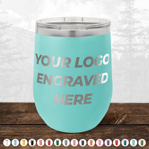 A turquoise Kodiak Coolers 12 oz stemless wine cup with your logo engraved, shown on wood with color options—perfect for those wanting custom engraved drinkware. No minimum order and sample volume pricing available.