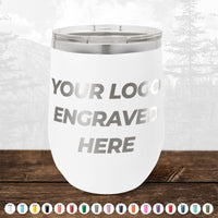 Showcased on a wood surface, the Kodiak Coolers NO MINIMAL ORDER Custom 12 oz Stemless Wine Cup displays “Your Logo Engraved Here” with color options—perfect for personalized mugs and engraved logo gifts.
