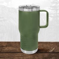 A Kodiak Coolers 20 oz travel mug with a laser-engraved Wisconsin Luxemburg Casco Spartans design and clear lid sits on a wooden surface, highlighting school drinkware against a mountain landscape.