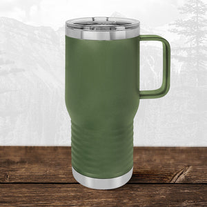 A Kodiak Coolers 20 oz travel mug with a laser-engraved Wisconsin Luxemburg Casco Spartans design and clear lid sits on a wooden surface, highlighting school drinkware against a mountain landscape.