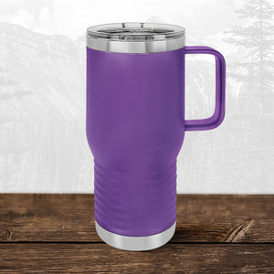 A Kodiak Coolers 20 oz travel mug with handle and clear lid, laser-engraved for Wisconsin Green Bay Bulldogs fans, sits on wood backed by mountains—perfect school drinkware for Meadowbrook supporters.