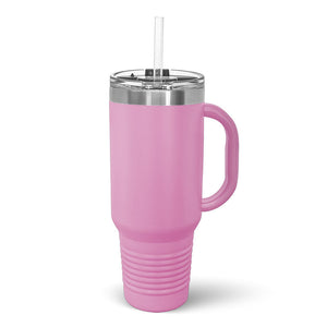A pink Kodiak Coolers insulated travel mug with a handle and a laser-engraved customizable engraving area displayed on a wooden background.