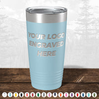 A light blue Kodiak Coolers Custom Tumbler with "Your Logo Engraved Here" on the front, ideal for personalized mugs or promo gifts; available in multiple colors. No setup fees, $200 minimal order.