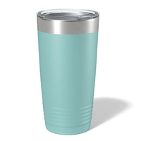 A Kodiak Coolers stainless steel tumbler with a customizable logo space, ideal as a promotional gift, displayed on a wooden surface with a blurred forest background.