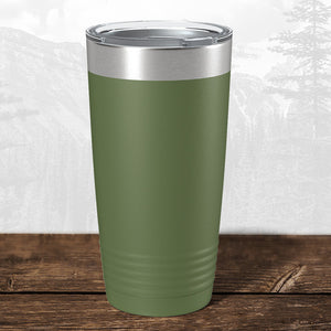 A Kodiak Coolers 20 oz stainless steel tumbler featuring a laser-engraved "Wisconsin Luxemburg Casco Spartans" design and clear lid rests on wood, perfect as a school drinkware gift or for your personalized mug collection.