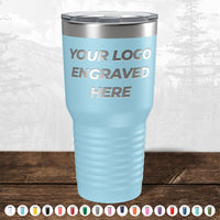 A light blue Kodiak Coolers tumbler, engraved with "Your Logo Here," is an ideal corporate gift. Available in various colors, this SALE tumbler features a laser-etched design and comes with no setup fees for a limited time.