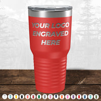 A red Kodiak Coolers tumbler with a silver lid features "YOUR LOGO ENGRAVED HERE." Along the bottom edge, PRIME BIG DAY DEALS displays color options for this custom laser-etched drinkware—no setup fees and fast turnaround.