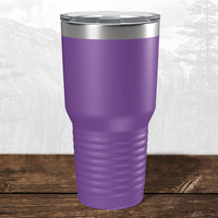 A 30 oz Kodiak Coolers tumbler with a laser-engraved Wisconsin Green Bay Bulldogs design and clear lid sits on wood with a mountain backdrop—ideal drinkware for Bulldogs fans.