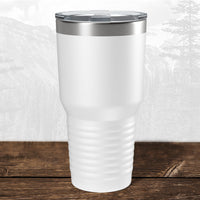 The Kodiak Coolers 30 oz tumbler, featuring a laser-engraved Wisconsin Luxemburg Casco Spartans design, sits on a wooden surface with a clear lid—ideal school drinkware for dedicated fans.