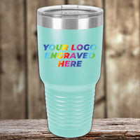 A turquoise tumbler with the words 'your logo engraved here'. This Kodiak Coolers custom tumbler serves as a corporate promotional gift option, and features a UV printed design.