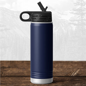 A Kodiak Coolers 20 oz water bottle with flip top straw, laser engraved with "Wisconsin Green Bay Bulldogs," rests on a wooden surface against a mountain backdrop.