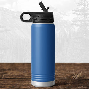 A 20 oz Wisconsin Green Bay Bulldogs water bottle by Kodiak Coolers, featuring a flip top straw lid and carrying handle, sits on wood with a mountain backdrop. The laser-engraved design adds spirit to this stylish hydration essential.