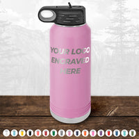 A Kodiak Coolers pink custom drinkware bottle with black lid is engraved with "YOUR LOGO ENGRAVED HERE." Available in various colors, it makes a perfect BLACK FRIDAY SALE promo gift—no setup fee and 1 side logo included. Pairs well with custom mugs.