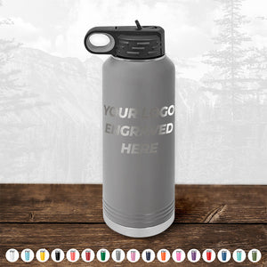 Kodiak Coolers Custom Water Bottles 40 oz with your Logo or Design Engraved - Low 6 Piece Order Minimal Sample Volume placed on a wooden surface.