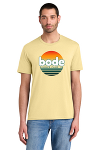 A man wears a Printify 2026 Bode Summer Bootcamp OG Logo Unisex Tri Blend T-Shirt in light yellow, featuring "bode SUMMER CAMP 2026" text with a sunset graphic. He stands against a white background.