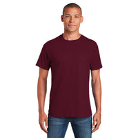 A man faces forward wearing a maroon Gildan 5000 Heavy 100% Cotton Custom T-Shirt (pack of 36, with custom screen printed logo) and blue jeans against a white background.