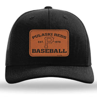 The designerapp Pulaski Reds Baseball - Est 1978 Richardson 112 Snapback Trucker Cap features a custom leather patch with "Pulaski Reds Baseball, Est. 1978" and a bold "P" at the center.