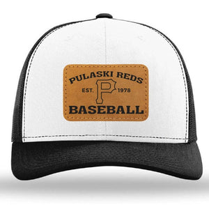 The Pulaski Reds Baseball Richardson 112 snapback trucker cap by designerapp features a custom leather patch with "Pulaski Reds Baseball Est. 1978" and a large "P" in the center. Black and white, adjustable fit.