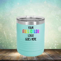 A light turquoise tumbler with a stainless steel lid, perfect for engraving. The tumbler features the text "Your Full Color Logo Goes Here" on a blurred light green and white background. Introducing the Custom UV Printed Drinkware - ONE TIME SPECIAL OFFER from Kodiak Coolers.