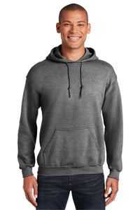 A person wearing a gray Gildan Heavy Blend™ Hooded Sweatshirt 18500 (Pack of 36), featuring a custom screen printed logo, front pocket, and drawstrings, pairs it with dark blue jeans and smiles at the camera.