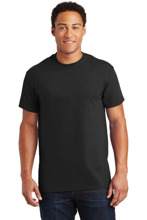 A person wearing a Gildan 100% US Cotton T-Shirt 2000 in plain black and jeans stands against a white background, making it ideal for promotional materials.