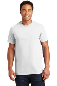 A man wearing a plain white Gildan - 100% US Cotton T-Shirt 2000 and blue jeans stands facing forward against a plain background, making an ideal image for promotional materials.