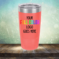 Red Custom UV Printed Drinkware - ONE TIME SPECIAL OFFER with a metallic lid on a wooden surface. The text on the tumbler reads "Your FULL COLOR logo goes here" in black and rainbow colors. The background is a gradient, starry backdrop. Perfect for those who love personalized tumblers or engraved coffee mugs to showcase their brand in style with Kodiak Coolers.
