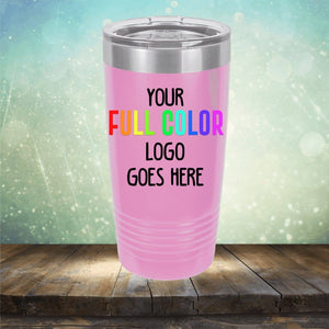 A pink insulated tumbler with a stainless steel lid on a wooden surface, displaying the text "Your Full Color Logo Goes Here" in multicolored letters against a gradient background. The perfect choice for engraving, this stylish Custom UV Printed Drinkware - ONE TIME SPECIAL OFFER by Kodiak Coolers keeps your drinks hot or cold for hours.