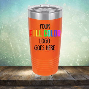 An orange insulated tumbler from Kodiak Coolers on a wooden surface with the text "Your Full Color Logo Goes Here" printed on it. This customized tumbler, called Custom UV Printed Drinkware - Single Side Printing Included in Price, is perfect for showcasing your brand in style, just like personalized coffee mugs or engraved wine cups.