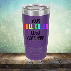 A purple Custom UV Printed Drinkware - Single Side Printing Included in Price with the text "Your Full Color Logo Goes Here" on its side, placed on a wooden surface against a light green, bokeh background. Perfect for companies seeking customized tumblers that stand out. Brand Name: Kodiak Coolers