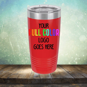 A red insulated tumbler with a lid, displaying the text "Your Full Color Logo Goes Here." The background is a wooden surface with a gradient, sparkly backdrop. Ideal for those seeking customized coffee mugs or tumblers with personalized engraving. Product Name: Custom UV Printed Drinkware - ONE TIME SPECIAL OFFER Brand Name: Kodiak Coolers