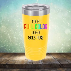 A yellow Custom UV Printed Drinkware - ONE TIME SPECIAL OFFER with a silver lid stands on a wooden surface. The text on the tumbler reads "Your Full Color Logo Goes Here" against a gradient background. Perfect for those who appreciate custom tumblers, it combines style with practicality. Brought to you by Kodiak Coolers.