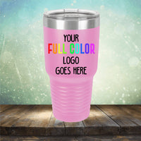 A pink insulated tumbler with a stainless steel lid and the text "YOUR FULL COLOR LOGO GOES HERE" printed on one side. The background features a blurred, sparkly outdoor setting, perfect for showcasing custom engravings or branding alongside your Kodiak Coolers Custom UV Printed Drinkware - ONE TIME SPECIAL OFFER collection.