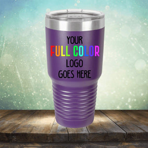 Purple insulated tumbler with "Custom UV Printed Drinkware - ONE TIME SPECIAL OFFER by Kodiak Coolers" engraved on it, set against a wooden surface and blurred background with light effects. Perfect for those who prefer stylish tumblers over traditional coffee mugs.
