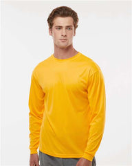 A man wearing a C2 Sport Performance Long Sleeve T-Shirt in yellow.