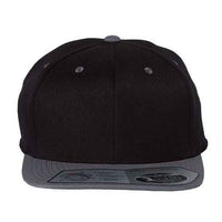 The Flexfit 110® Flat Bill Snapback Hat, by Flexfit, is a black and gray hat with a structured six-panel design and a sticker on the brim, viewed from the front.