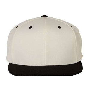 The Flexfit 110® Flat Bill Snapback Hat by Flexfit is a structured six-panel white baseball cap, highlighted with black details, including a black brim and black dots on the top. It comes with a snapback closure for an adjustable fit.