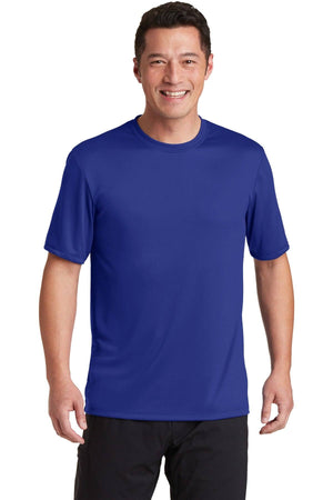 Wearing a Hanes Cool Dri Performance T-Shirt 4820, plain and blue, paired with black pants, a person smiles warmly at the camera against a white background.