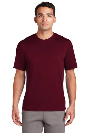 Man wearing a Hanes Cool Dri Performance T-Shirt 4820 in maroon and gray pants, standing against a white background.