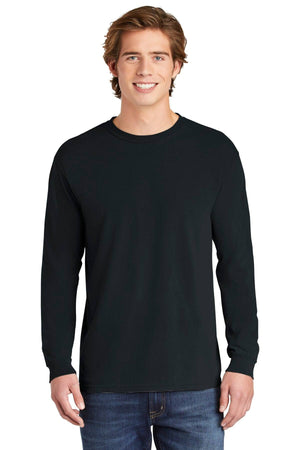 A young man faces forward, smiling against a white background, wearing blue jeans and a Comfort Colors Heavyweight Ring Spun Long Sleeve T-Shirt 6014 by Comfort Colors.