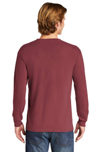 A person with light brown hair is shown from the back, wearing a Comfort Colors Heavyweight Ring Spun Long Sleeve T-Shirt 6014 in maroon and blue jeans against a plain white background.
