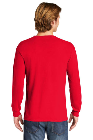 A person is seen from the back, against a white background, wearing a red Comfort Colors Heavyweight Ring Spun Long Sleeve T-Shirt 6014 and blue jeans.