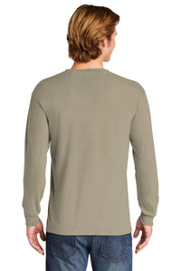 A person with light brown hair, seen from the back, is wearing a Comfort Colors Heavyweight Ring Spun Long Sleeve T-Shirt 6014 in beige and blue jeans.