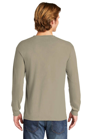 A person with light brown hair, seen from the back, is wearing a Comfort Colors Heavyweight Ring Spun Long Sleeve T-Shirt 6014 in beige and blue jeans.