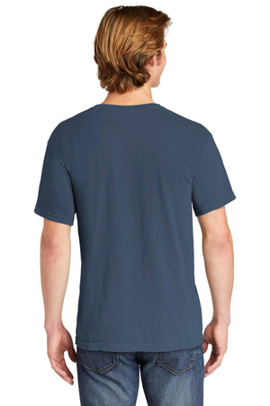 A person with light brown hair stands with their back to the camera, wearing blue jeans and a Comfort Colors Heavyweight Ring Spun Pocket T-Shirt 6030 by Comfort Colors.