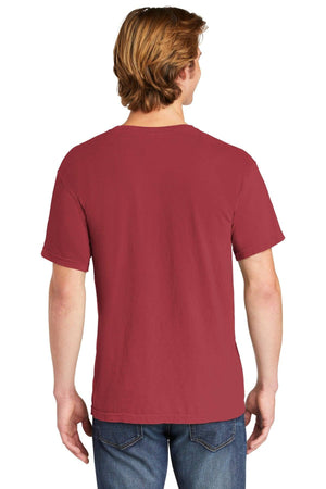A person with light brown hair is seen from behind wearing a Comfort Colors Heavyweight Ring Spun Pocket T-Shirt 6030 in dark red and blue jeans against a white background.
