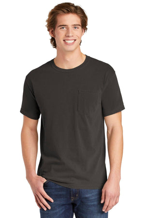 A young man wears the Comfort Colors Heavyweight Ring Spun Pocket T-Shirt 6030 in black with blue jeans, standing and smiling at the camera.
